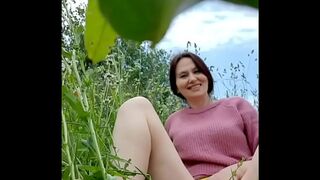 Naked horny naughty MILF in a chamomile field masturbates, pisses and wards off a wasp / Angela-sexy MILF