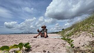 curvy MILF flashing hairy pussy on public beach